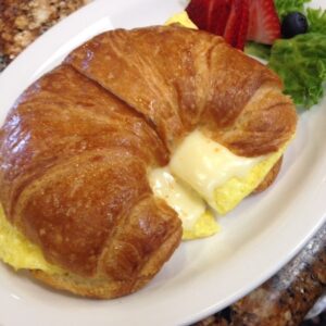 Croissant with eggs and cheese